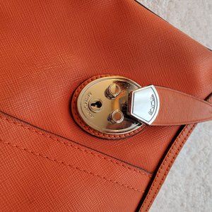 Orange Tumi Seffiano Leather Purse with Lock detail